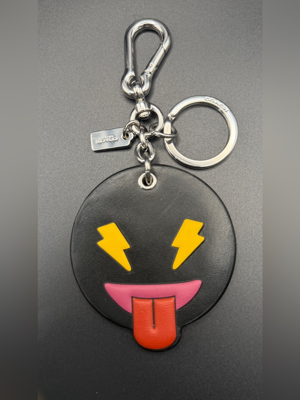 Coach Black Leather Emoji Keychain with Yellow Lightning Eyes & Red Tongue